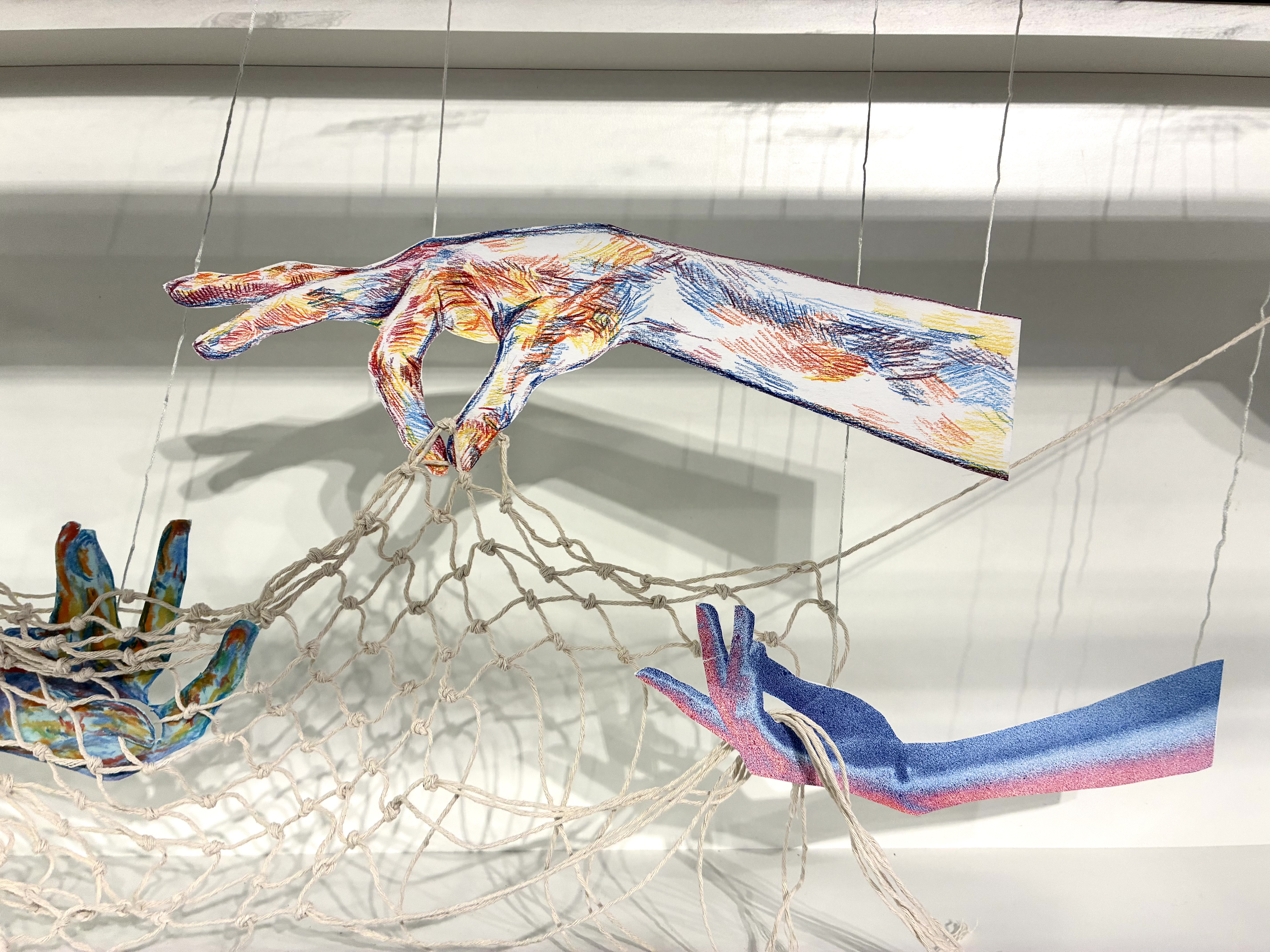 paper hands holding nets